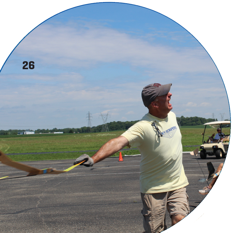 Jan Langelius prepares to launch his aircraft while competing in Hand Launch Glider at the Outdoor FF Nats. Jan won the event and received the Tulsa Glue Dobber trophy. Pangell photo.
