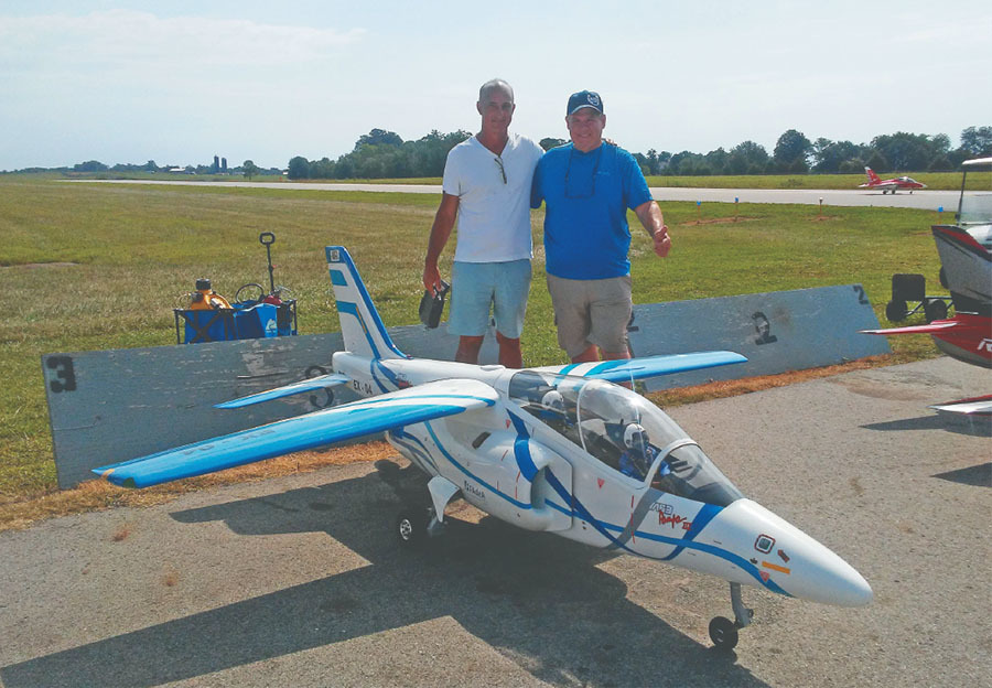 Sergio Testa (L) is shown with his impressive IA-63 Pampa that he flies in an incredibly smooth, scalelike manner. Sergio hails from Argentina, yet he travels to the US to attend numerous jet modeling events. 