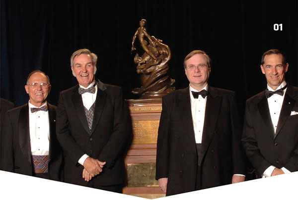 AMA member Burt Rutan stands left of the 2004 Collier Trophy, which he and others received for SpaceShipOne. Photo provided by Burt Rutan. 