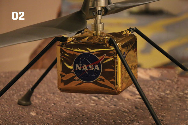 A close-up photo of a version of the Mars Ingenuity Helicopter at the June 2022 Collier Trophy Dinner. 