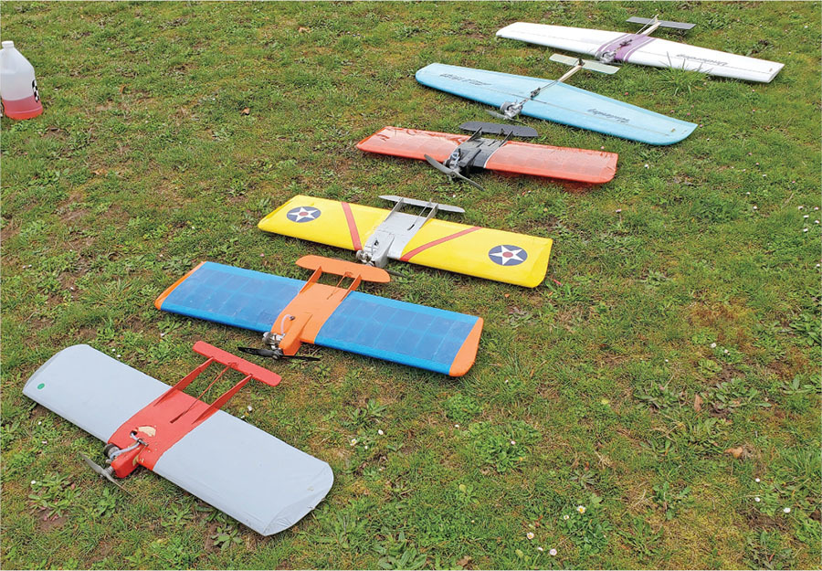 A collection of Vintage AMA CL Combat models is lined up for flight. See the text for details. Photo by Gene Pape.