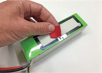 Small squares of colored Velcro are a handy way to mark charged batteries—as long as you are diligent about it. 